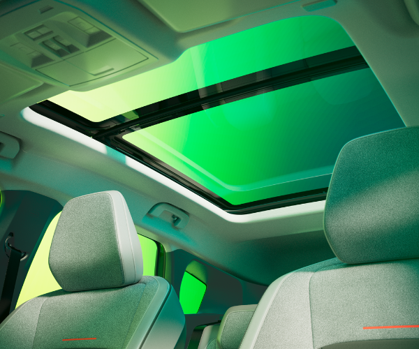 Interior view of car with panoramic sunroof and front seats.