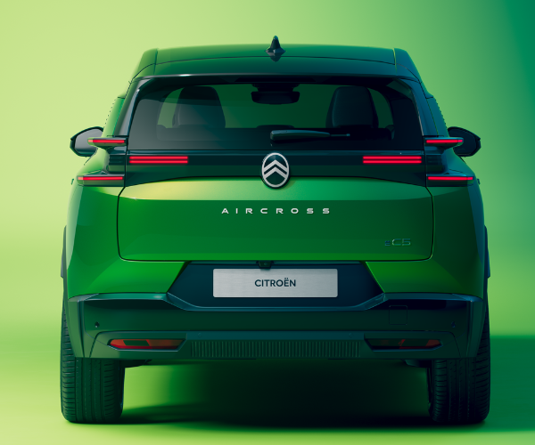 Rear view of a green Citroën C5 Aircross SUV with red tail lights.