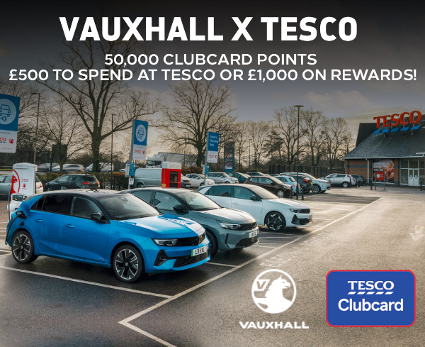 Vauxhall cars charging at Tesco with Clubcard promotion details shown.