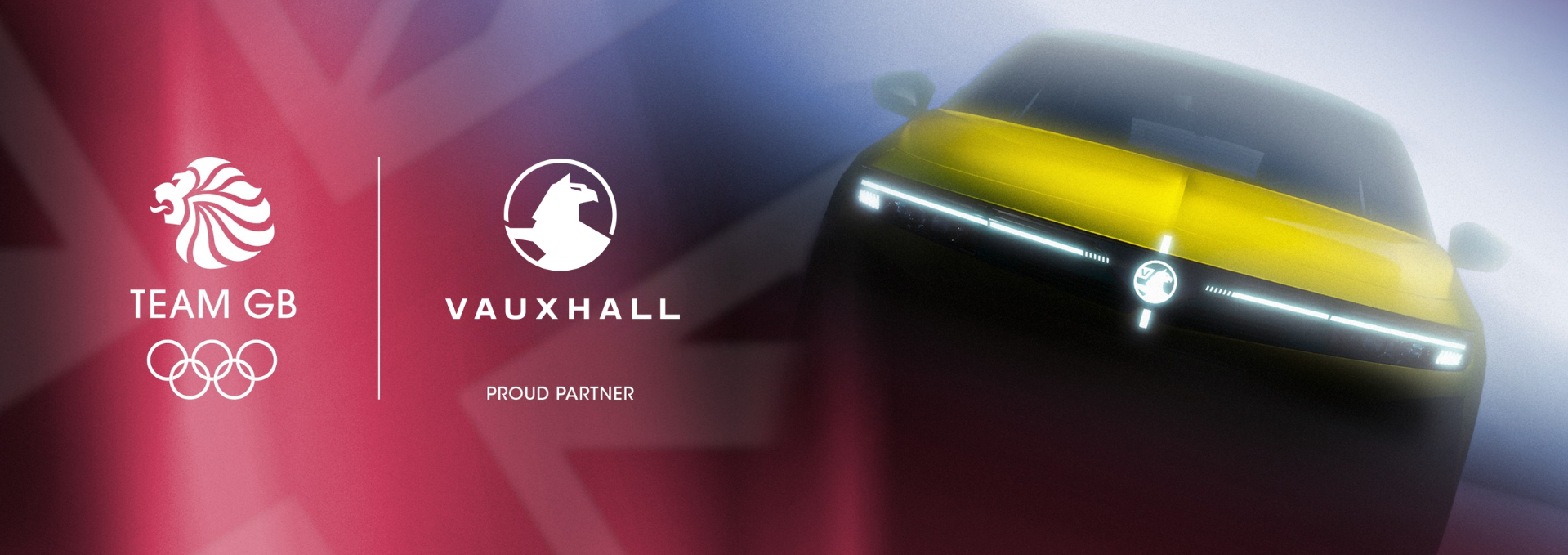 Yellow car front view with Team GB and Vauxhall partnership logos.