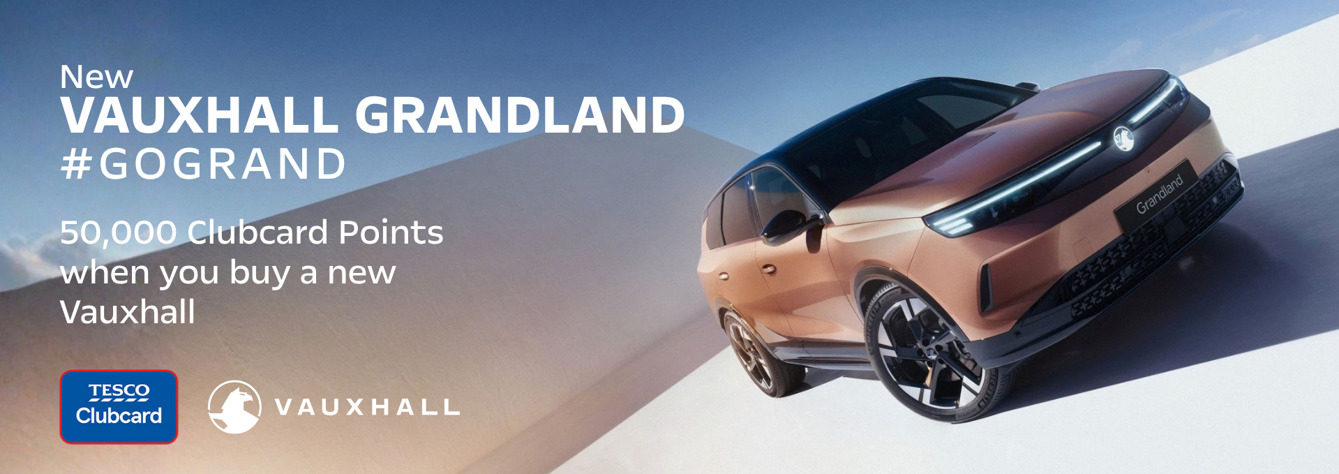 New Vauxhall Grandland car with promotion text and Tesco Clubcard logo.
